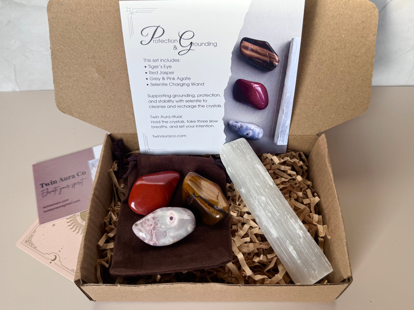 Crystal gift set with Red Jasper, Blue and Grey Agate and Tiger's eye. With Selenite wand. Brown Velvet crystal bag and ritual card. 